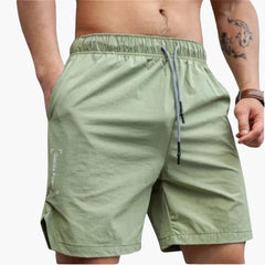 Herren Badeshorts mit Seitentaschen und elastischem Bund in Grün