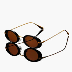 Damen Sonnenbrille mit runden Gläsern und UV-Schutz in Schwarzgold