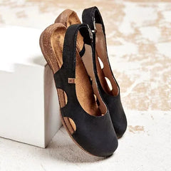 Ravena – Flache Ledersandalen mit Rückenrieme in Schwarz