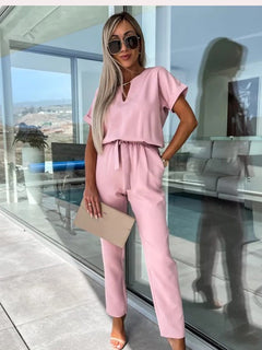 Kurzarm-Jumpsuit mit Gürtel für Damen in Rosa
